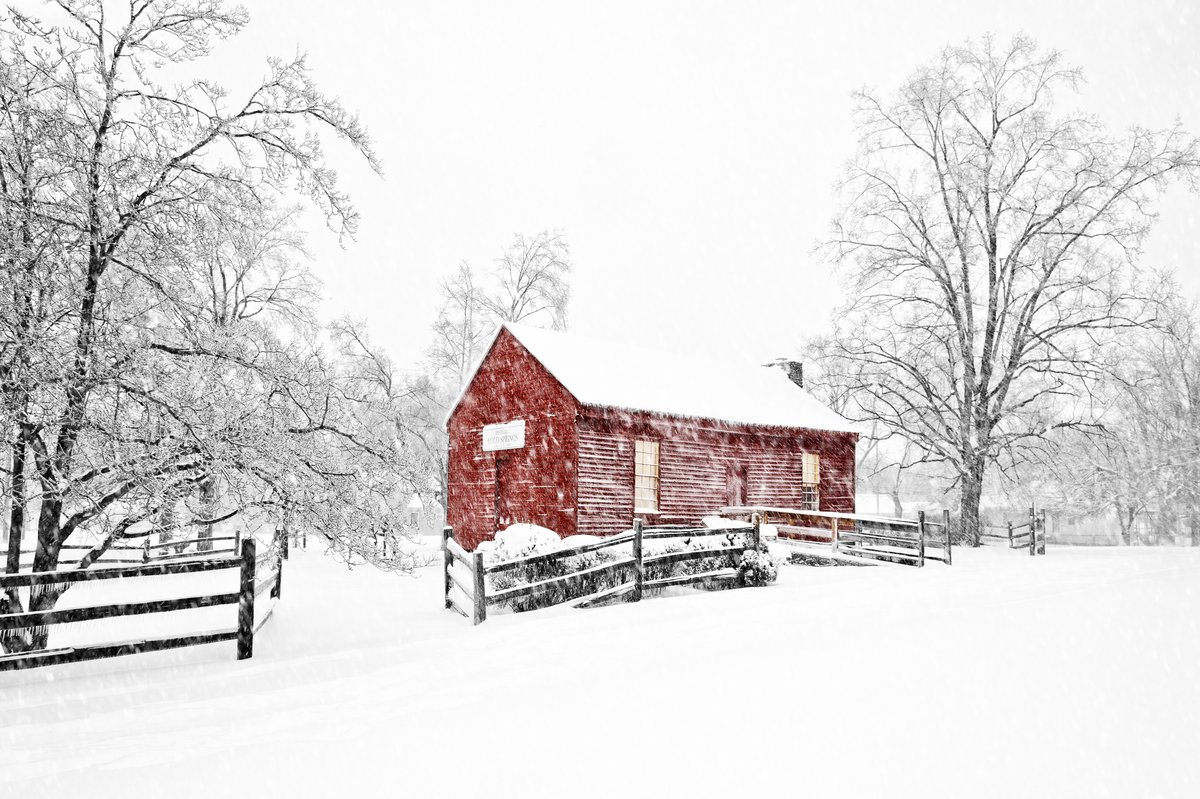 A red barn in snow